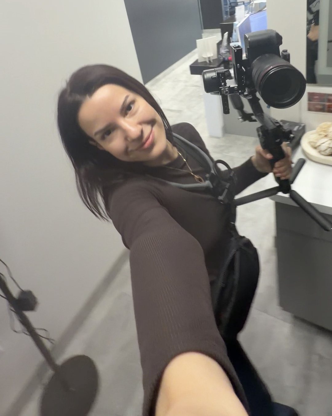 Arina Tann filming on location at a Phoenix client's office
